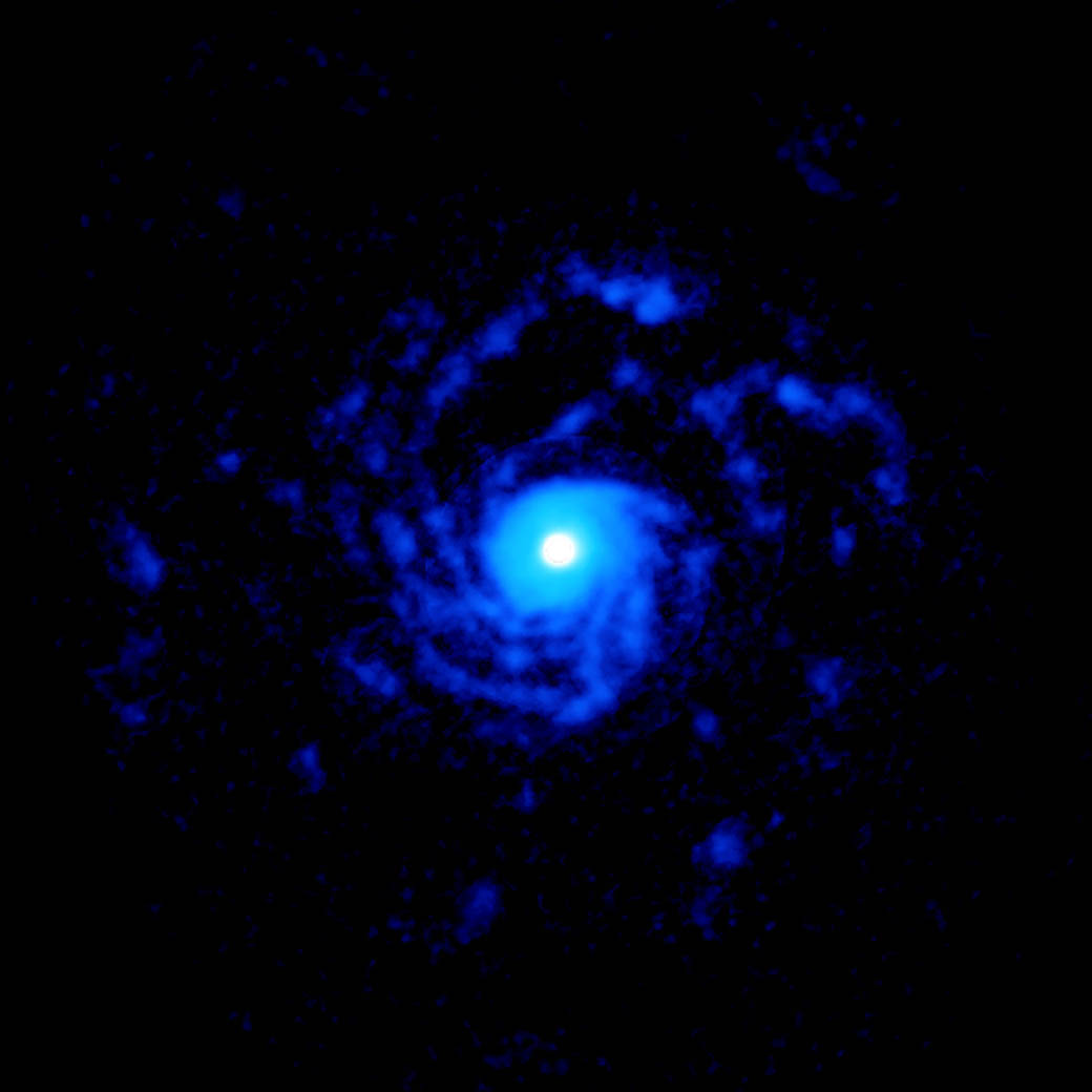 ALMA image of the planet-forming disk around the young star RU Lup, showing a giant set of spiral arms made out of gas.  The structure extends to nearly 1000 astronomical units from the star.