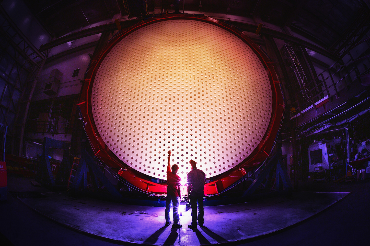 The Giant Magellan Telescope primary mirror segment 5 sits vertically at the Richard F. Caris Mirror Lab at the University of Arizona. Each of the seven mirror segments of the Giant Magellan Telescope is 8.4 meters in diameter, together forming a single optical surface of 24.5 meters with a total collecting area of 368 square meters.