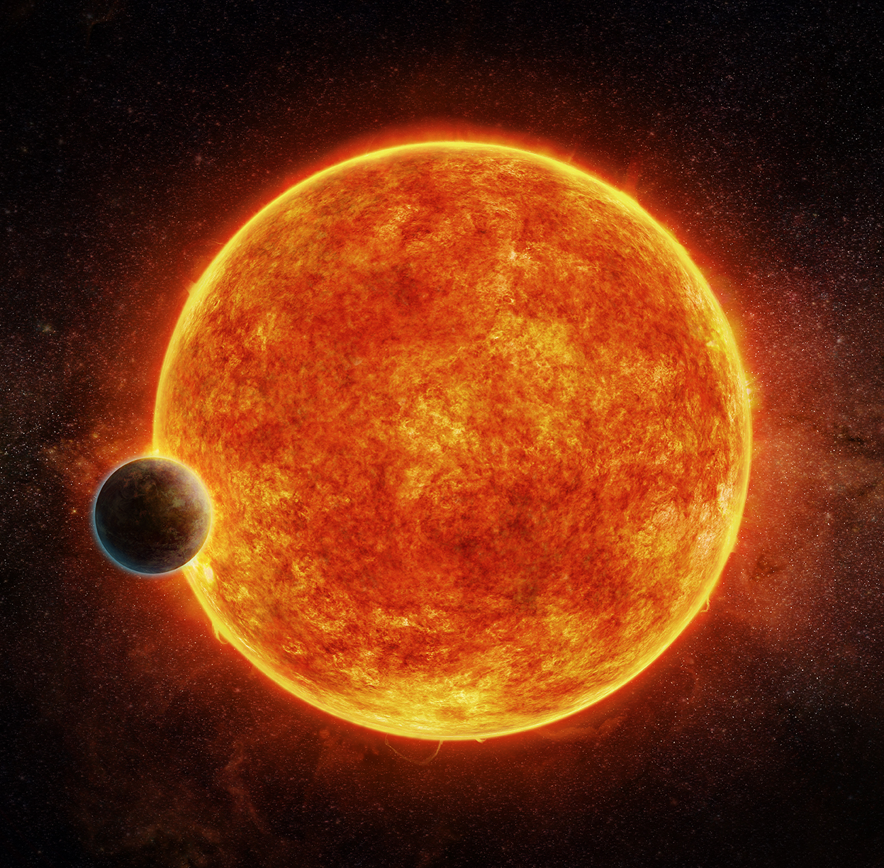 An artist's impression of the newly-discovered rocky exoplanet, LHS 1140b. This planet is located in the liquid water habitable zone surrounding its host star, a small, faint red star named LHS 1140. The planet weighs about 6.6 times the mass of Earth and is shown passing in front of LHS 1140. Depicted in blue is the atmosphere the planet may have retained.