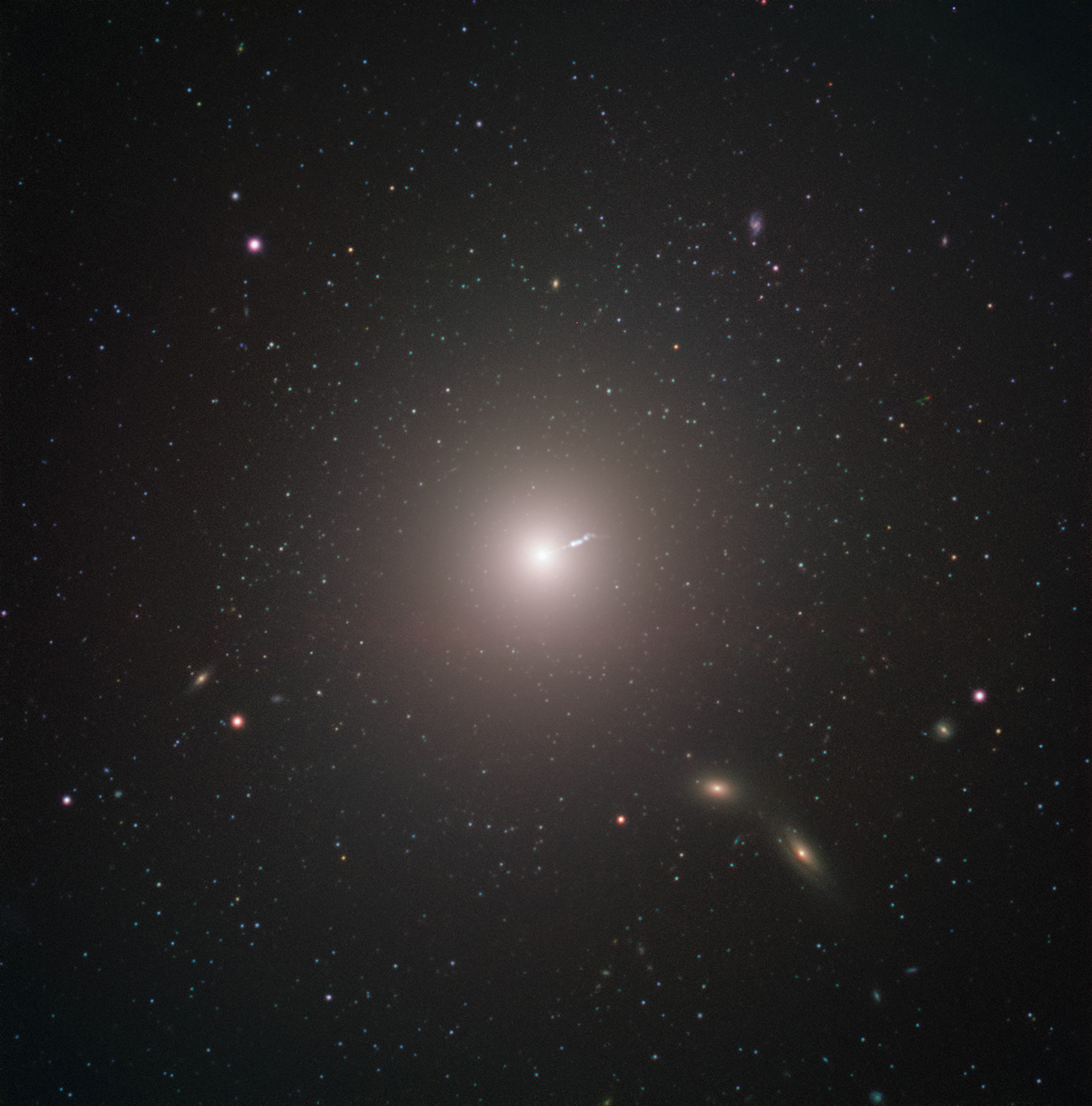 The supermassive black hole imaged by the EHT is located in the center of the elliptical galaxy M87, located about 55 million light years from Earth. This image was captured by FORS2 on ESO's Very Large Telescope. The short linear feature near the center of the image is a jet produced by the black hole.