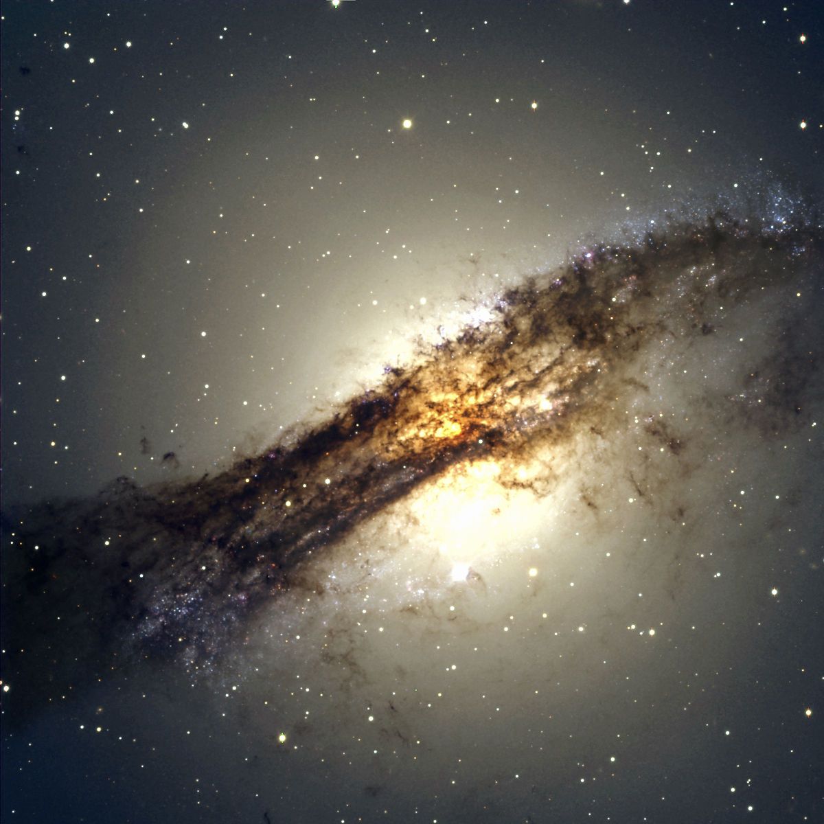 The giant elliptical galaxy Centaurus A shows a split personality because it hides a gaseous spiral at its core. When Centaurus A collided with a spiral galaxy 300 million years ago, it slurped up the spiral&#039;s gases, which formed a new spiral inside the larger galaxy.