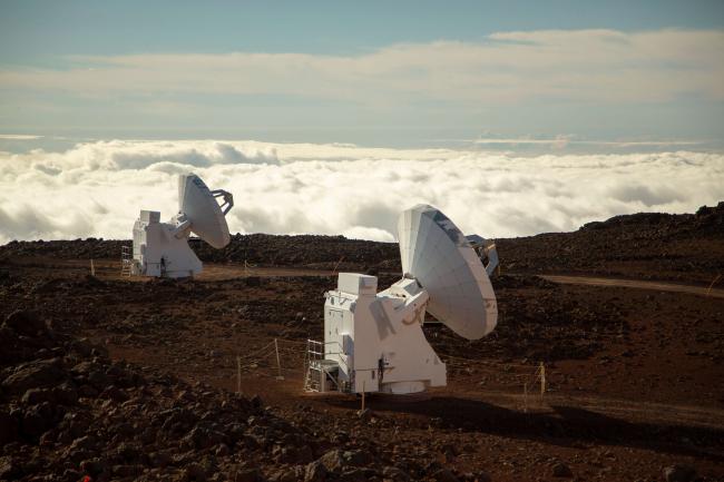 two of the dishes comprising the Submillimeter Array in Hawaii