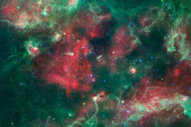 A bubbling cauldron of star birth is highlighted in this image from NASA's Spitzer Space Telescope of Cygnus X. 