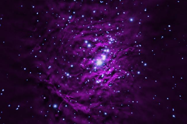 In this image, X-rays from Chandra (blue) reveal individual young stars, which are hot and energetic.