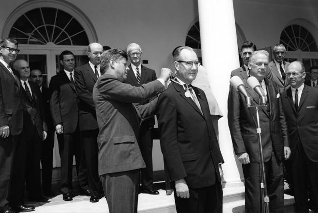SAO Director Fred Lawrence Whipple is awarded the Distinguished Federal Civilian Service Award in 1963 by President John F. Kennedy outside the White House in the Rose Garden