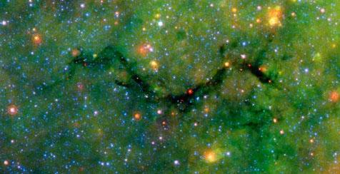 An infrared image of an infrared dark cloud (IRDC) taken by the IRAC camera on the Spitzer Space Telescope.