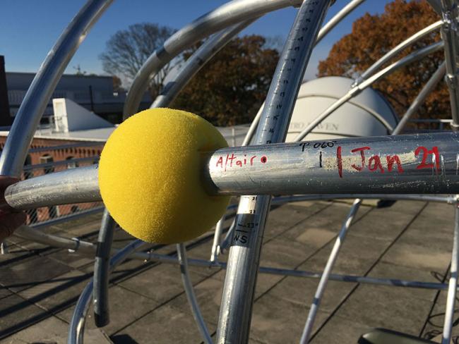 A close-up of one of the foam balls users can place on the Maxotron's rails to represent the Sun or another celestial object. 