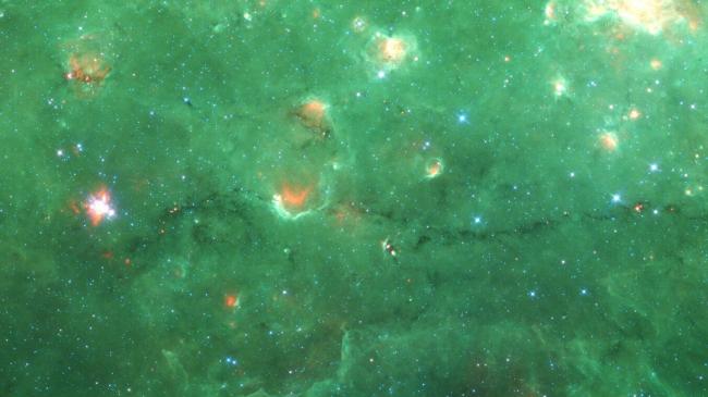 Nessie, a cloud of cold gas and dust, is a "bone" tracing the Milky Way's spiral arm structure.