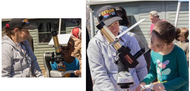 Students using telescopes